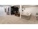 Finished basement has open layout with a built-in media center and neutral colors at 619 S Gilpin St, Denver, CO 80209