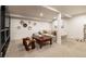 Finished basement has an open layout with soft neutral colors and a decorative mirror display at 619 S Gilpin St, Denver, CO 80209