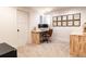 Finished basement office features a built-in desk, plush carpet, and modern design at 619 S Gilpin St, Denver, CO 80209