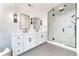Bright bathroom featuring tile flooring, double vanity, and a glass shower at 619 S Gilpin St, Denver, CO 80209