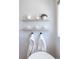Bright bathroom featuring floating shelves and white towels at 619 S Gilpin St, Denver, CO 80209