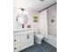 Finished basement bathroom with modern vanity, sleek fixtures, and stylish blue floor tiles at 619 S Gilpin St, Denver, CO 80209