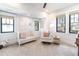 Bright bedroom featuring neutral colors, modern furniture, and carpet flooring at 619 S Gilpin St, Denver, CO 80209