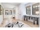 Bright entryway with wood floors and unique black accent table at 619 S Gilpin St, Denver, CO 80209