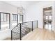 Bright hallway with large windows and modern black railings at 619 S Gilpin St, Denver, CO 80209