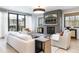 Bright living room with modern fireplace, TV, stylish decor, and access to an outdoor area at 619 S Gilpin St, Denver, CO 80209
