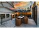 Outdoor patio with a table and chairs under umbrellas, ideal for enjoying the sunset and outdoor living at 619 S Gilpin St, Denver, CO 80209