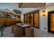 Outdoor patio with a table and chairs, perfect for dining and entertaining, adjacent to the main house at 619 S Gilpin St, Denver, CO 80209