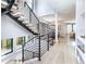 Modern staircase with wood steps and black metal railing in a bright, open space at 619 S Gilpin St, Denver, CO 80209