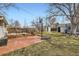 Spacious backyard featuring a patio, deck, and lawn, offering ample space for outdoor activities and relaxation at 5668 S Foresthill St, Littleton, CO 80120