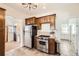 Functional kitchen space equipped with stainless steel appliances and ample storage at 5668 S Foresthill St, Littleton, CO 80120