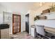 Cozy home office space with built-in desk, shelving, and natural light at 5668 S Foresthill St, Littleton, CO 80120