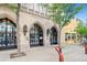 Exterior of a historic town hall featuring gothic archways, stone facade, and well-maintained landscaping at 5668 S Foresthill St, Littleton, CO 80120