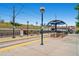 Outdoor train platform featuring covered waiting areas and clear signage, providing a safe and accessible transit hub at 5668 S Foresthill St, Littleton, CO 80120