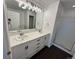Elegant bathroom with double sinks, marble countertops, and a glass-enclosed shower at 15555 E 40Th Ave # 11, Denver, CO 80239