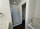 Bathroom featuring glass shower and tile surround at 15555 E 40Th Ave # 11, Denver, CO 80239
