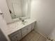 Bathroom featuring white vanity and tiled floors at 15555 E 40Th Ave # 11, Denver, CO 80239