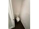 Small bathroom features a toilet with a white tank and a dark brown wood floor at 15555 E 40Th Ave # 11, Denver, CO 80239
