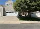 Charming home exterior with a well-manicured lawn and mature tree providing ample shade at 15555 E 40Th Ave # 11, Denver, CO 80239