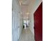 Bright foyer with tile flooring, neutral walls, and high ceilings leading to the main living space at 15555 E 40Th Ave # 11, Denver, CO 80239