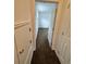 The hallway has a carpet floor and leads to a room at 15555 E 40Th Ave # 11, Denver, CO 80239