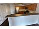 A well-lit kitchen with wooden cabinets and stainless steel appliances at 15555 E 40Th Ave # 11, Denver, CO 80239