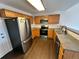 Functional kitchen featuring modern stainless steel appliances and ample cabinet storage at 15555 E 40Th Ave # 11, Denver, CO 80239