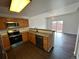 Efficient kitchen with updated stainless appliances, plenty of counter space, and natural lighting at 15555 E 40Th Ave # 11, Denver, CO 80239