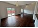 Open living area with hardwood floors, sliding door access to outdoor area, and a bright, airy atmosphere at 15555 E 40Th Ave # 11, Denver, CO 80239