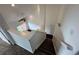 The carpeted stairs lead to the living room with a ceiling fan and a window at 15555 E 40Th Ave # 11, Denver, CO 80239