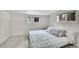 Cozy bedroom with serene views from the windows, offering a tranquil retreat at 10887 Goodheart Ave, Conifer, CO 80433