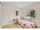Bright bedroom with whimsical bedding and a charming bedside table at 10887 Goodheart Ave, Conifer, CO 80433