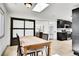 Dining room with wooden table, skylight and a view of kitchen at 10887 Goodheart Ave, Conifer, CO 80433