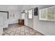 Welcoming entryway with a decorative rug, natural light and built-in storage at 10887 Goodheart Ave, Conifer, CO 80433