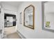 Stylish entryway with built-in storage and a view of the modern kitchen at 10887 Goodheart Ave, Conifer, CO 80433