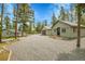Spacious property with multiple structures, offering ample space for living and storage at 10887 Goodheart Ave, Conifer, CO 80433