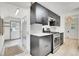 Well-designed kitchen with modern appliances and ample storage, adjacent to a convenient entryway at 10887 Goodheart Ave, Conifer, CO 80433