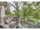 Outdoor balcony featuring chairs, a small table, and a view of the surrounding park at 1895 York St, Denver, CO 80206