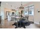 Elegant dining area with a view to the open kitchen and stainless steel appliances at 1895 York St, Denver, CO 80206