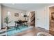 Bright home office with hardwood floors, desk, and natural light streaming in at 1895 York St, Denver, CO 80206