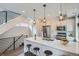 Open-concept kitchen with pendant lighting, stainless steel appliances, and a breakfast bar at 1895 York St, Denver, CO 80206