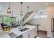 Contemporary kitchen featuring an island with modern pendant lighting and an open floor plan at 1895 York St, Denver, CO 80206