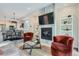 Modern living room blends seamlessly with a dining area and decorative fireplace at 1895 York St, Denver, CO 80206