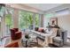 Bright living room features balcony access and comfortable seating at 1895 York St, Denver, CO 80206