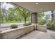 Covered front porch overlooking grassy park at 1895 York St, Denver, CO 80206