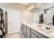 Sleek bathroom with double sinks, contemporary fixtures, and a spacious shower at 8953 Falcon St, Firestone, CO 80504