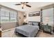 Cozy bedroom with a patterned bedspread, natural light, and views of the outdoors at 8953 Falcon St, Firestone, CO 80504