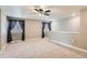 Spacious bonus room with plush carpet, multiple windows and half wall at 8953 Falcon St, Firestone, CO 80504