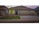 Beautiful home featuring a manicured lawn, attached garage, and well-maintained exterior at 8953 Falcon St, Firestone, CO 80504