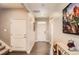 An inviting hallway with hardwood floors leads to various rooms, showcasing the home's layout at 8953 Falcon St, Firestone, CO 80504